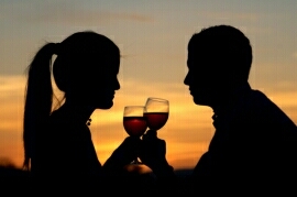 Ibiza sunset couple with a wine toast