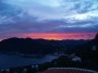 Kleurrijke Ibiza zonsondergang zichtbaar van op het dak van deze Ibiza villa.
