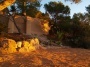 Ibiza Yoga vacation terrace with beach sand and rock garden. 