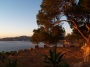 Ibiza Yoga vacation terrace with sunrise colors and sea views.