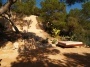 Ibiza Yoga vacation terrace in the rock garden with lounge bed.