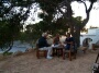 Leatitia, Jack and Christophe playing cards at the table on the yoga terrace.