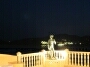 Statue David standing on the terrace on an Ibiza night.